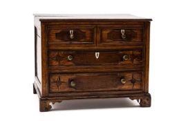 MINIATURE WELSH OAK CHEST OF TWO LONG & TWO SHORT DRAWERS the beaded drawers inlaid with mahogany,