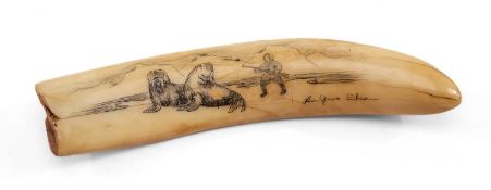 SCRIMSHAW WALRUS TOOTH, carved and stained with scene of Eskimo hunting two walrus, signed, 10cms