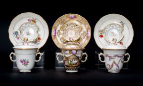 THREE BERLIN PORCELAIN CHOCOLATE CUPS, COVERS & STANDS, 19th Century, moulded basketweave borders,