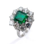 PLATINUM EMERALD & DIAMOND CLUSTER RING, the central emerald (7 x 8mms approx.) measuring 2.2cts