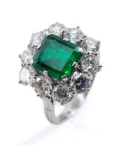 PLATINUM EMERALD & DIAMOND CLUSTER RING, the central emerald (7 x 8mms approx.) measuring 2.2cts