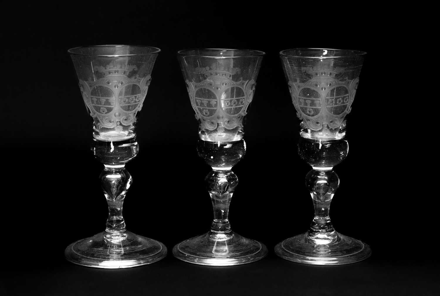 SET OF THREE GERMAN ARMORIAL WINE GLASSES, mid-18th Century, probably Silesian, of soda lass, each