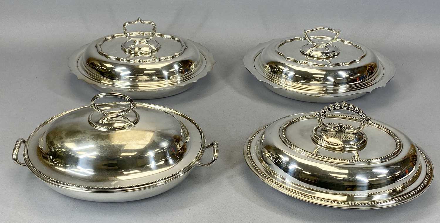 FOUR OVAL LIDDED EPNS ENTREE DISHES, including a pair with wavy edge detail and one with screw off