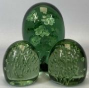 THREE VICTORIAN GREEN GLASS DUMPS, lot comprises a large example with interior vase of numerous