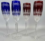 SET OF FOUR WATERFORD 'CLARENDON' CUT GLASS CHAMPAGNE FLUTES, 2 x red and 2 x blue, 25cms H