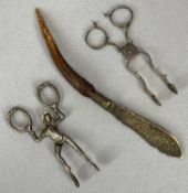 TWO PAIRS OF EARLY & NOVELTY SUGAR NIPS & AN EPNS HORN HANDLED KNIFE, the early pair bearing lion