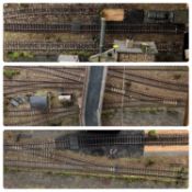 O GAUGE RAILWAY - wooden layout in three sections with track and scenery, buildings, various rolling