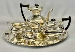 FOUR-PIECE WALKER & HALL SILVER PLATED TEA SERVICE ON A NON-MATCHING OVAL TWO-HANDLED TRAY, the