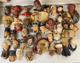 VAST COLLECTION OF BOSSONS WALL PLAQUES / WALL MASKS, various figures including Dickens characters