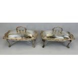 PAIR OF SILVER PLATE ON COPPER FOOD SERVERS, scroll handles to ribbed lids and foliate scroll