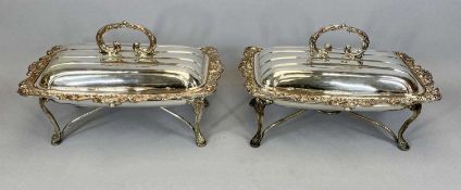 PAIR OF SILVER PLATE ON COPPER FOOD SERVERS, scroll handles to ribbed lids and foliate scroll