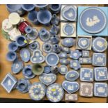 LARGE COLLECTION OF WEDGWOOD BLUE & WHITE JASPERWARE including vases, lidded trinket boxes, pin