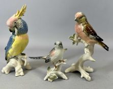 THREE KARL ENS PORCELAIN BIRD FIGURES, cockatoo 20cms H, blood linnet, 18cms H, and a long tailed