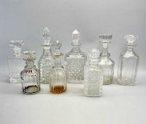 FOUR CIRCULAR CUT GLASS DECANTERS, 31cms H, and 4 x others Provenance: deceased estate Gwynedd