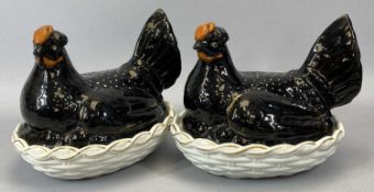 TWO JACKFIELD-TYPE STAFFORDSHIRE POTTERY HEN-ON-NESTS, with white basket bases, 18.5cms H, 22cms