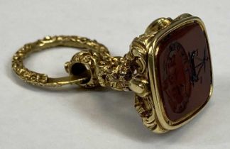 EARLY VICTORIAN GOLD SEAL FOB WITH CARVED CARNELIAN INSET, elaborate hanging ring and acanthus