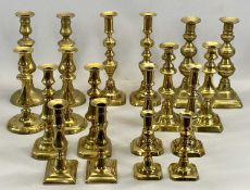 NINE PAIRS OF VICTORIAN BRASS CANDLESTICKS, 27.5cms H (the tallest) Provenance: private collection