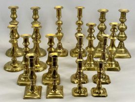 NINE PAIRS OF VICTORIAN BRASS CANDLESTICKS, 27.5cms H (the tallest) Provenance: private collection