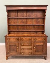 OAK NORTH WALES DRESSER CIRCA 1840, the wide boarded back upper rack with three shelves, shaped