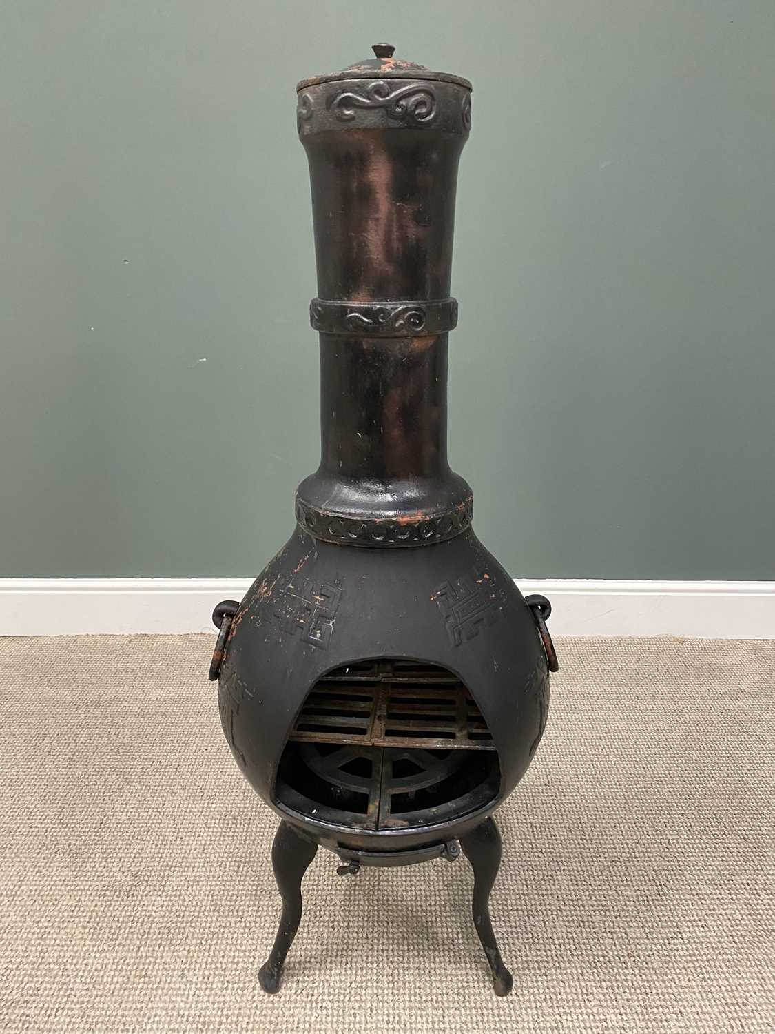 CAST IRON GARDEN CHIMINEA FIREPLACE with Oriental-style decoration in relief and ring side