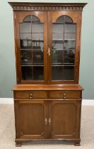 GOOD REPRODUCTION MAHOGANY BOOKCASE CUPBOARD, having arched detail to the lift off crown over twin