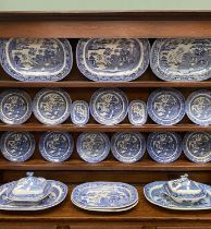 BLUE & WHITE WILLOW PATTERN DRESSER SET, 22 PIECES, to include 5 x large meat platters, 2 x smaller,