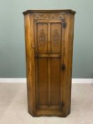 REPRODUCTION OAK CORNER HALL ROBE, single door with carved upper panel and frieze details, fancy