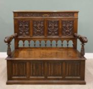 CARVED OAK BOX SEAT SETTLE early 20th Century, the straight back having a leaf carved upper frieze