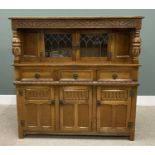 REPRODUCTION OAK CARVED BUFFET SIDEBOARD, having leaded glass upper doors below a carved front