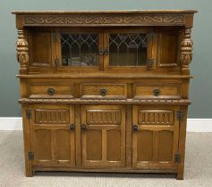 REPRODUCTION OAK CARVED BUFFET SIDEBOARD, having leaded glass upper doors below a carved front