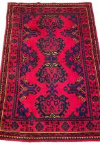 'TURKEY RED' PATTERN HAND KNOTTED RUG, 252 x 150cms Provenance: private collection Denbighshire