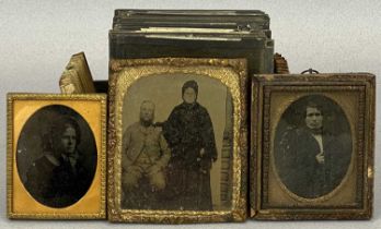 THREE DAGUERREOTYPE PHOTOGRAPHS IN FRAMES, together with a number of glass slides Provenance:
