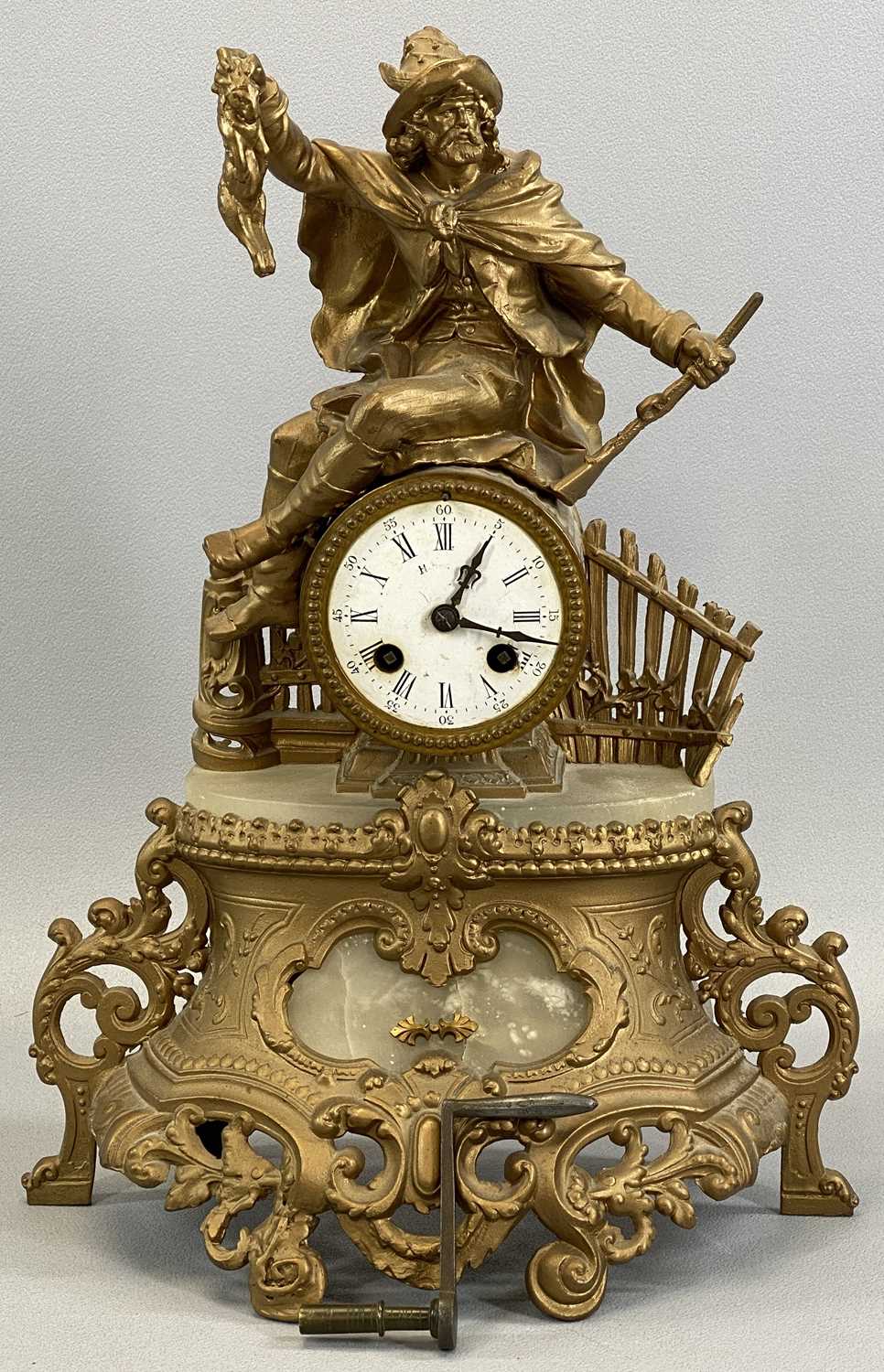 F MARTI FRENCH GILT METAL FIGURAL MANTEL CLOCK with huntsman astride a barrel case, housing a