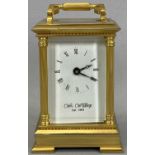 WILLIAM WIDDOP MODERN BRASS CASED CARRIAGE CLOCK WITH KEY, the white dial set with Roman numerals in