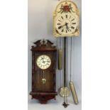 VINTAGE GERMAN WALL CLOCK, arched painted dial with black Roman numerals, twin hanging weights and