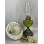 VICTORIAN OIL LAMP WITH PIERCED CAST IRON BASE, green glass reservoir, 28cms H (excl. funnel), and a