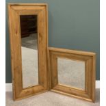 TWO MODERN OAK FRAMED WALL MIRRORS, both having substantial outer frames, one being a tall