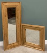 TWO MODERN OAK FRAMED WALL MIRRORS, both having substantial outer frames, one being a tall