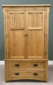 MODERN OAK WARDROBE with twin upper doors over two lower opening drawers, with metal back plates and