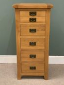 MODERN OAK BEDROOM CHEST OF FIVE DRAWERS, with metal back plates and swing pull handles, on stile