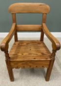 ANTIQUE PITCH PINE SUBSTANTIAL FARMHOUSE ARMCHAIR with decorative apron to the front and sides, on