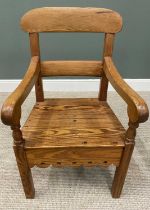 ANTIQUE PITCH PINE SUBSTANTIAL FARMHOUSE ARMCHAIR with decorative apron to the front and sides, on