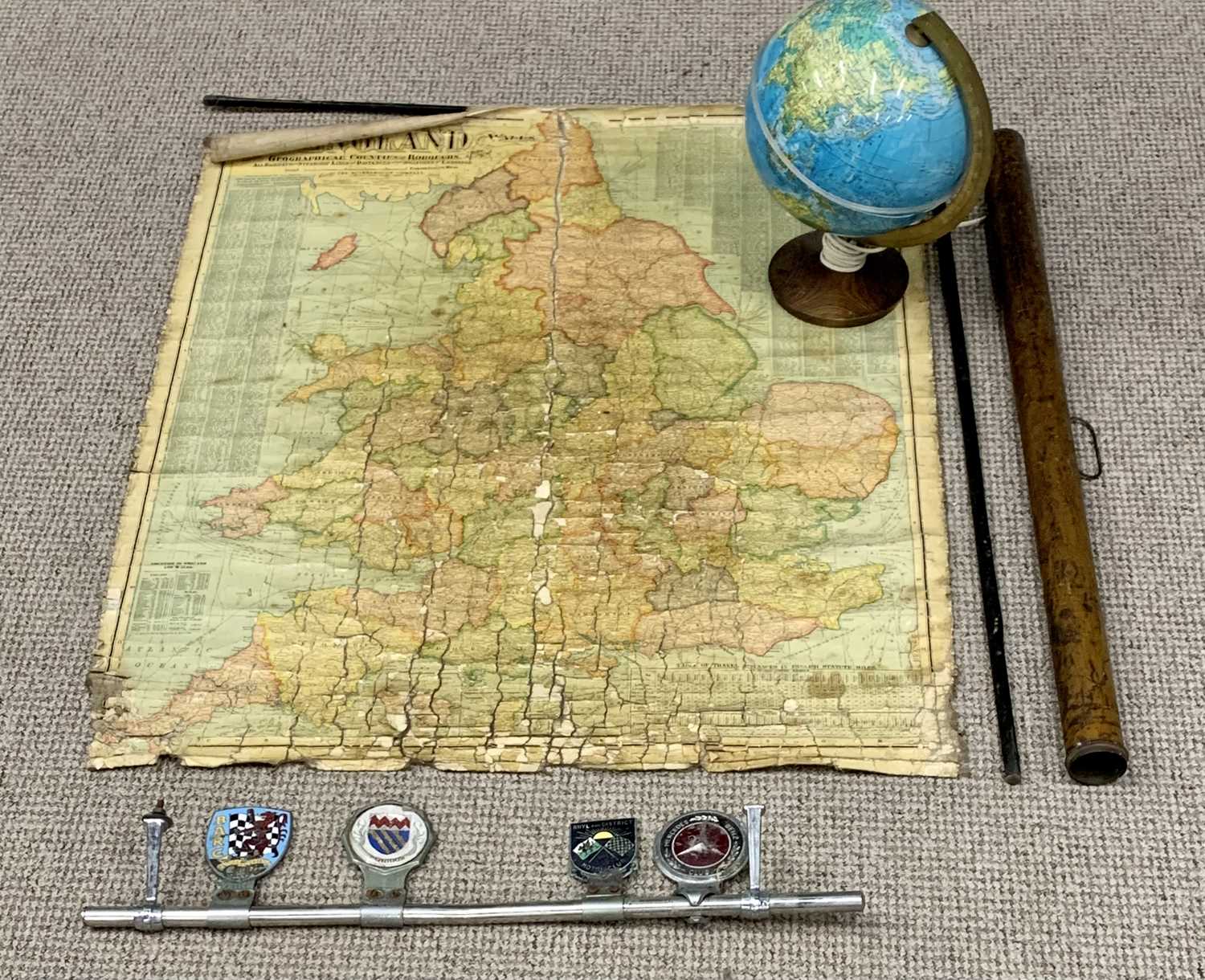 TRAVEL COLLECTABLES comprising chrome bumper bar holding four various badges including British