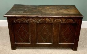 ANTIQUE CARVED OAK COFFER, having a three-plank top and carved front upper frieze, peg joined