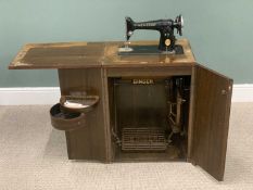 VINTAGE SINGER TREDLE SEWING MACHINE, in a work station cabinet, having a foldover top and twin