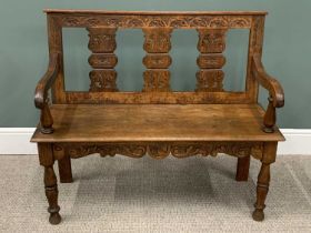 CARVED OAK HALL BENCH having a triple splat back and shaped arms, on turned front supports, 90cms H,