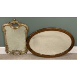 TWO VINTAGE & REPRODUCTION WALL MIRRORS, comprising a circa 1900 inlaid mahogany oval wall mirror