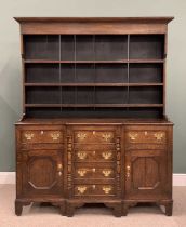 NORTH WALES ANGLESEY OAK BREAKFRONT DRESSER, having a wide boarded back three-shelf rack over a base