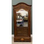 LATE 19TH CENTURY FRENCH WALNUT ARMOIRE having a shaped arched top cornice over a single bevel edged