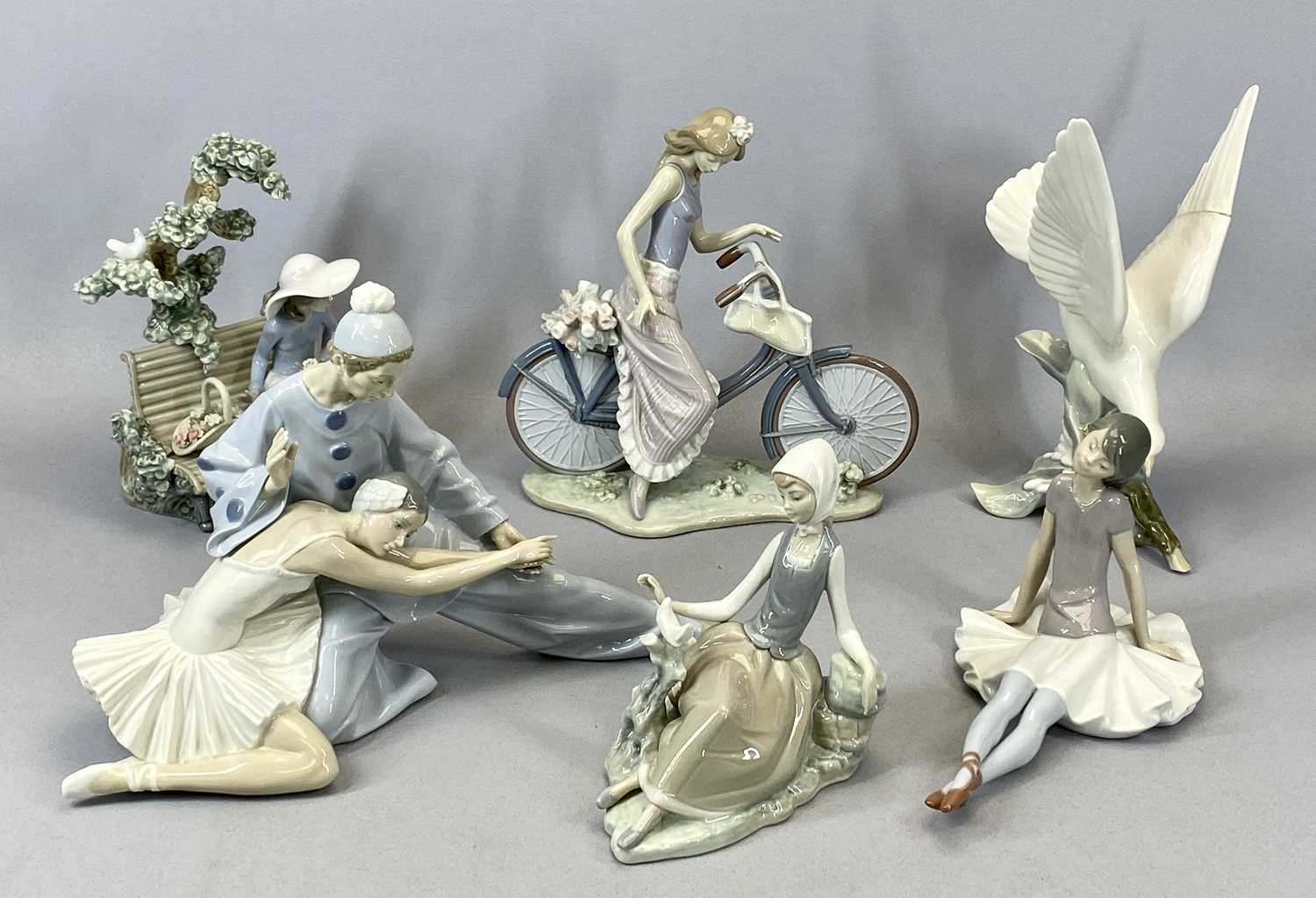 SIX LLADRO FIGURINES, girl on bicycle, 26cms H, ballet dancers, 24cms H, girl seated on bench, 23cms